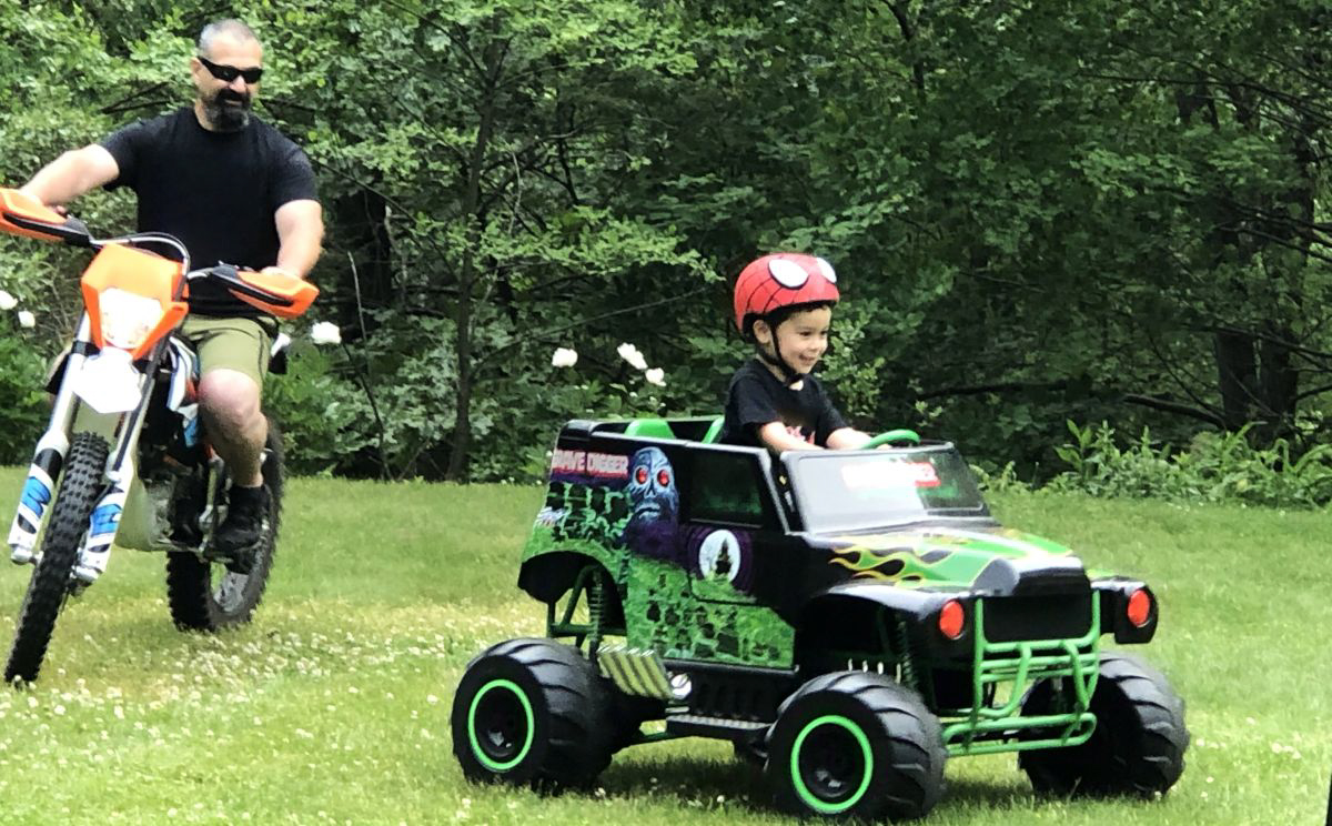 On the KTM E-bike chasing my son on his powerwheels Grave Digger.